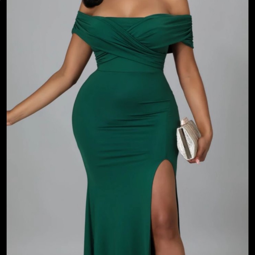 Emerald green offshoulder dress.